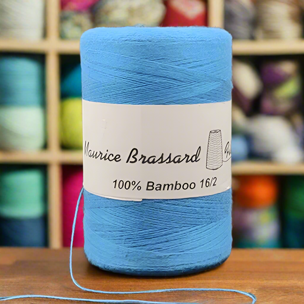 Maurice Brassard weaving yarn