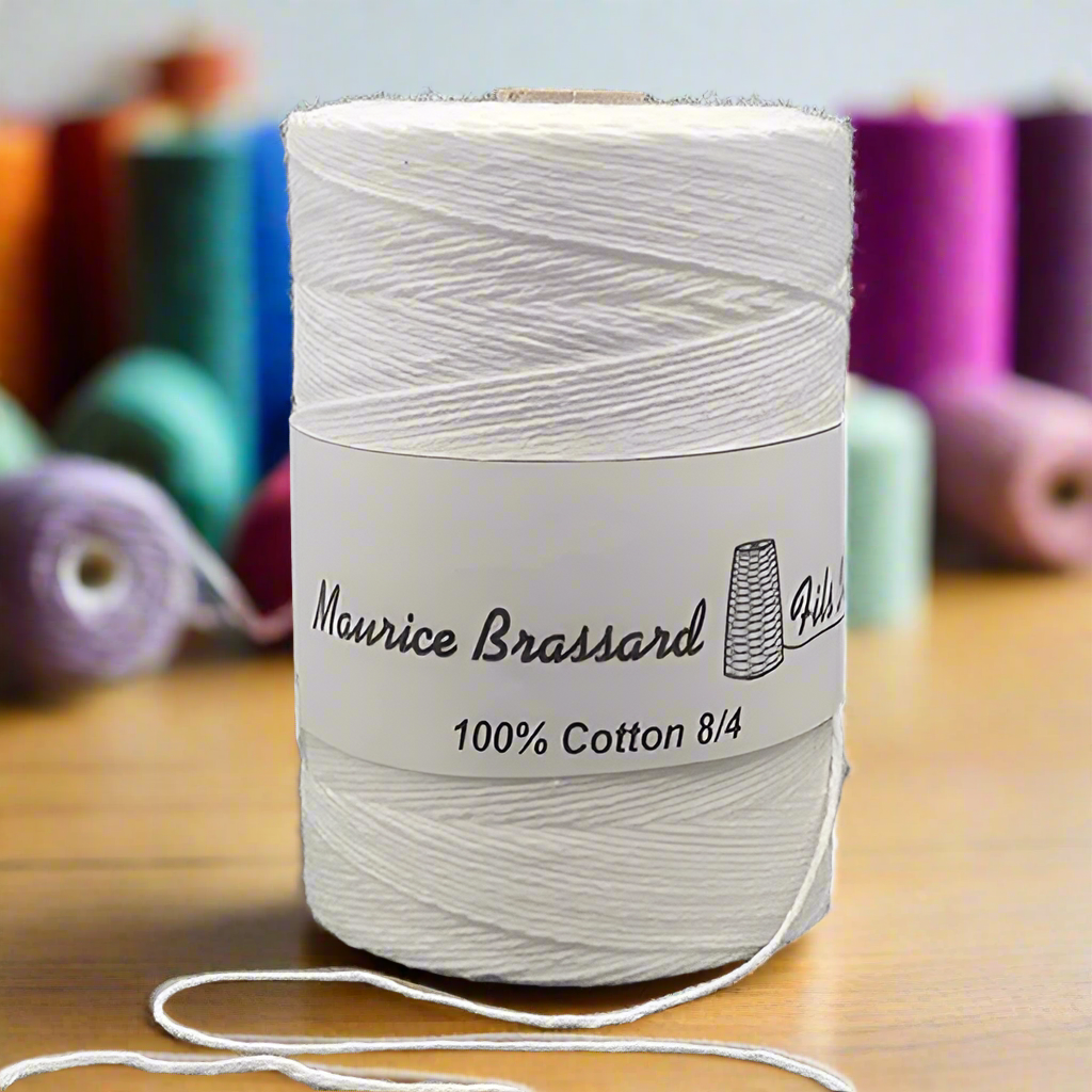 Maurice Brassard weaving yarn