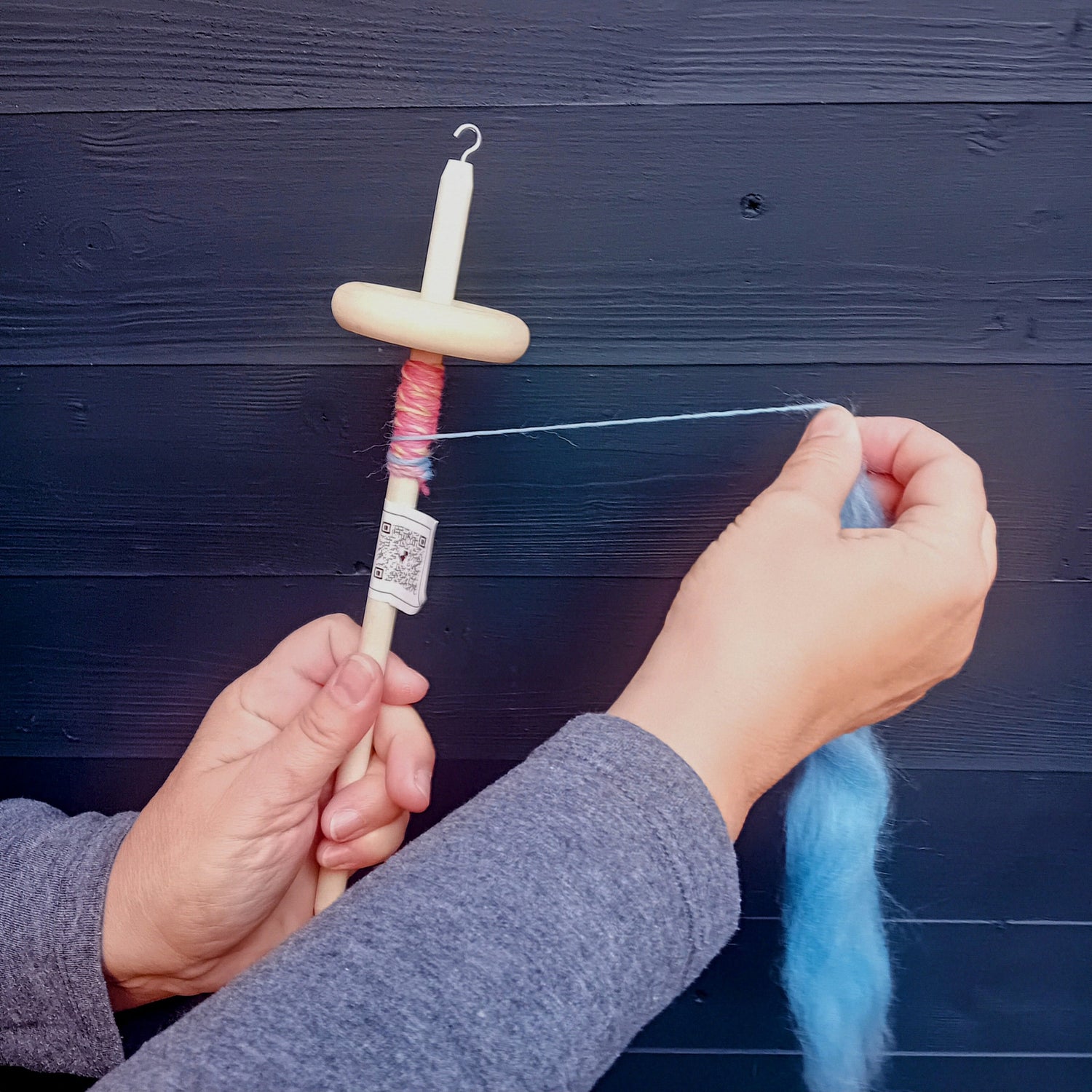 Hand spin wool fibre with a drop spindle