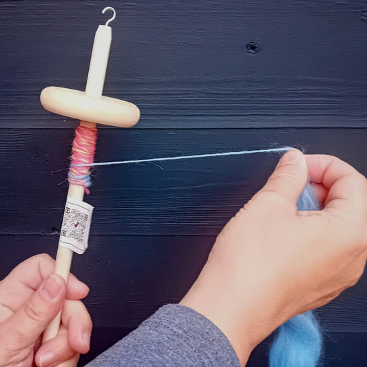 spinning yarn on a drop spindle