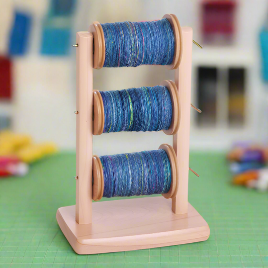 Lazy kate with spinning wheel bobbins