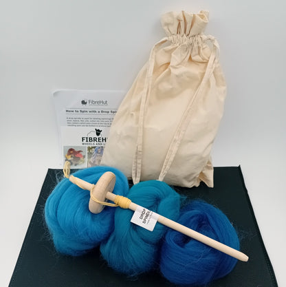 Drop spindle kit with blue themed fibre