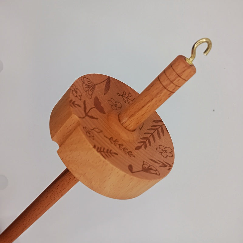 drop spindle for spinning wool into yarn