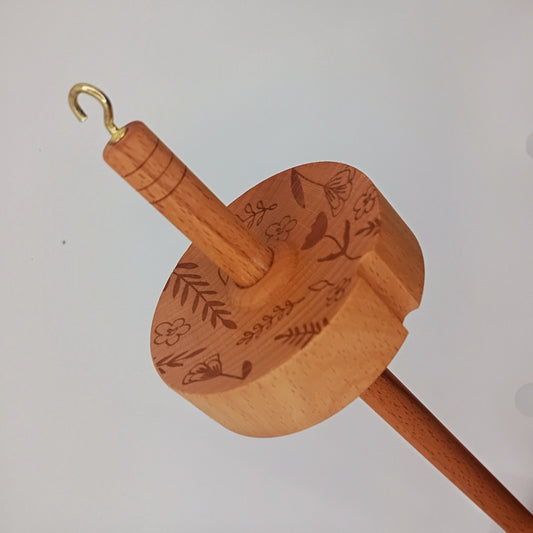 drop spindle for spinning wool into yarn
