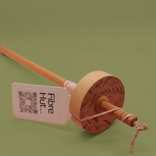 drop spindle for spinning wool into yarn