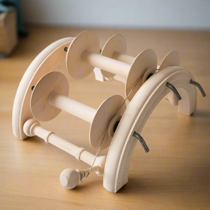 Lazy kate with spinning wheel bobbins