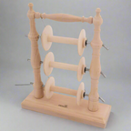 Lazy kate with spinning wheel bobbins