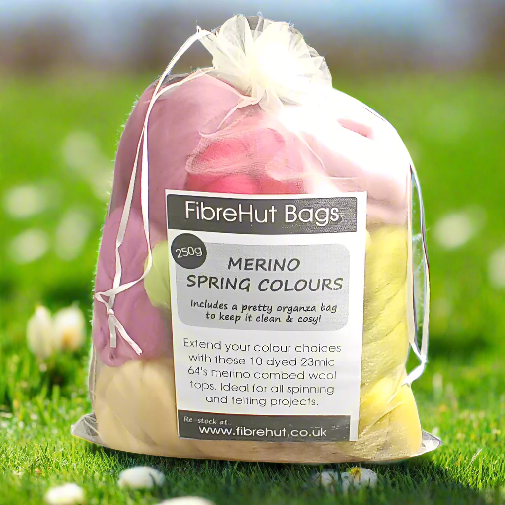 Bag of merino wool tops with a label on grass